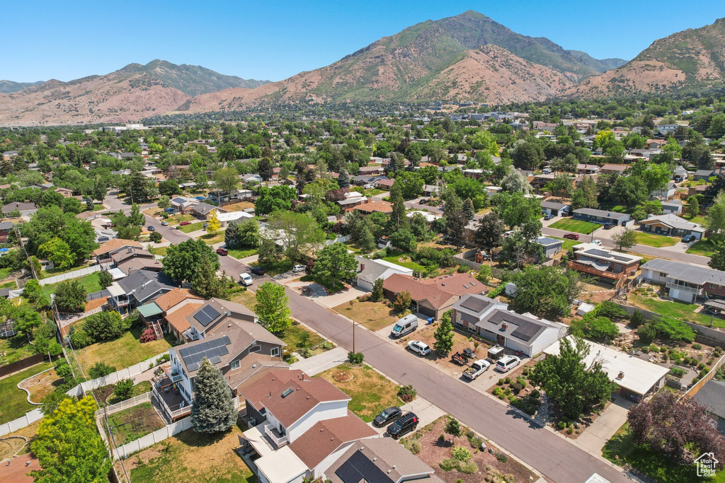 View of property location featuring a mountain backdrop and nearby suburban area