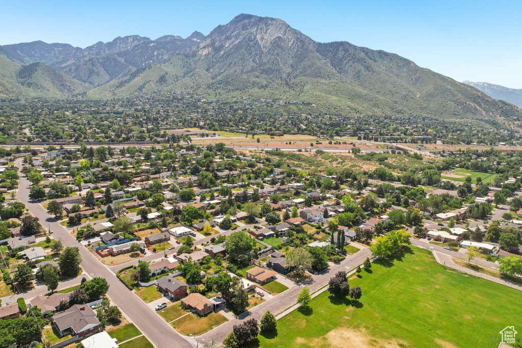 Aerial view of residential area featuring a mountainous background