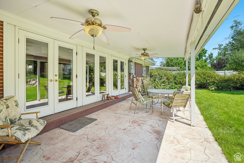View of patio / terrace featuring french doors, ceiling fan, and outdoor dining space