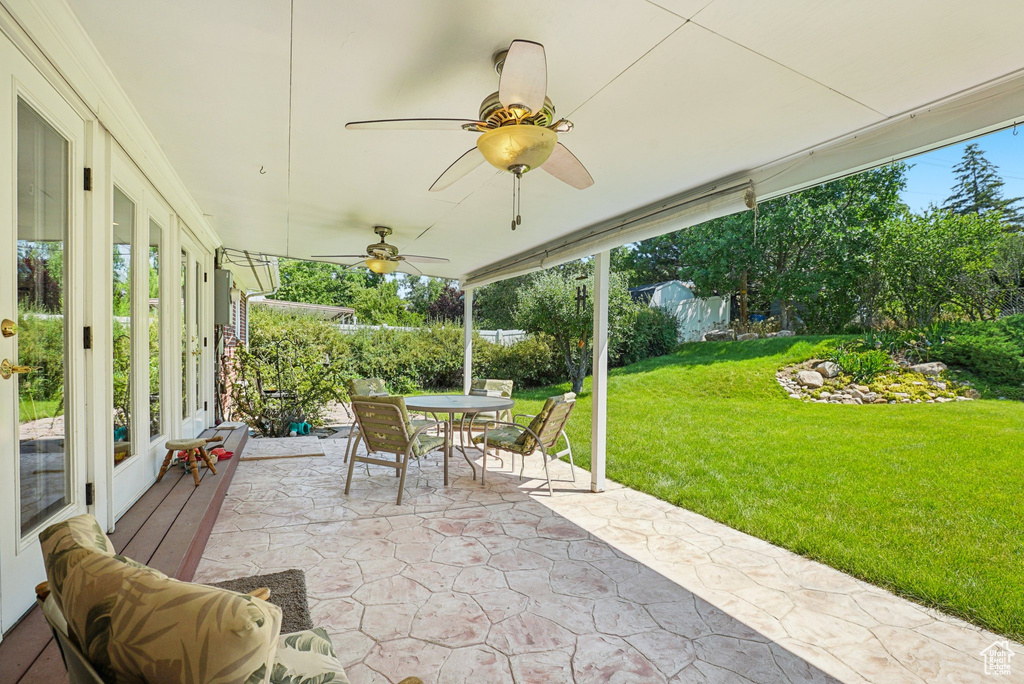 View of patio / terrace with outdoor dining space and ceiling fan