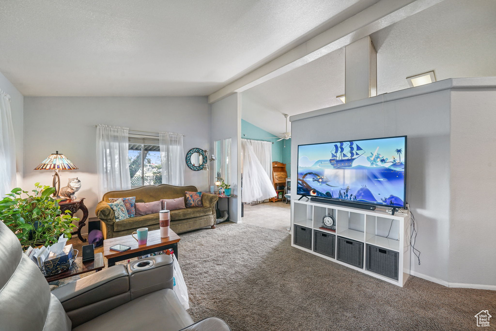 Carpeted living room featuring baseboards