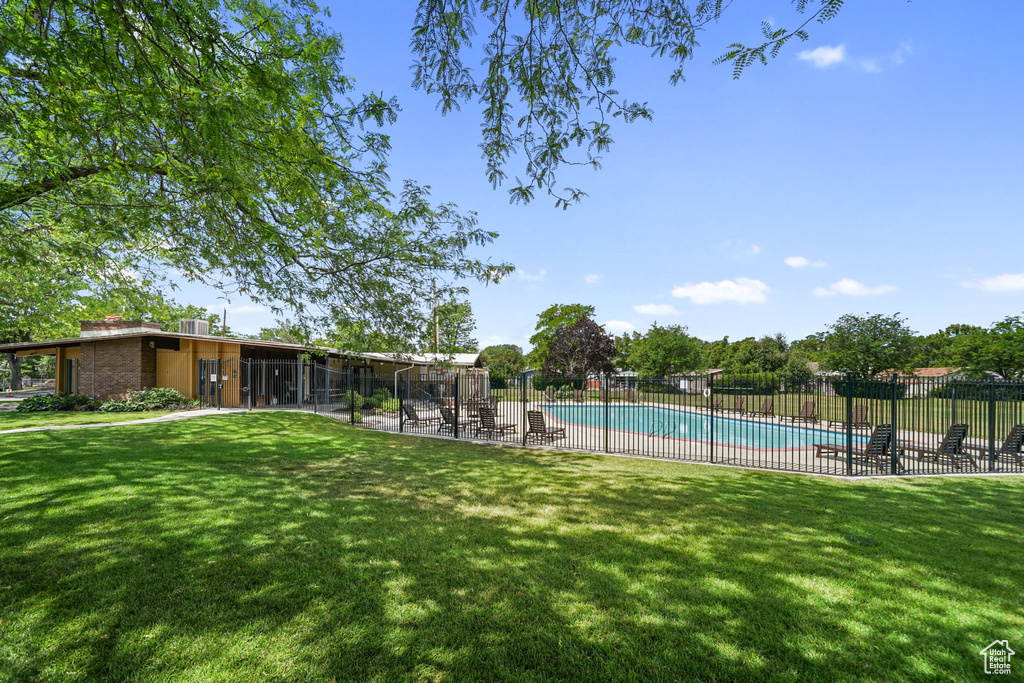 Community pool with a patio