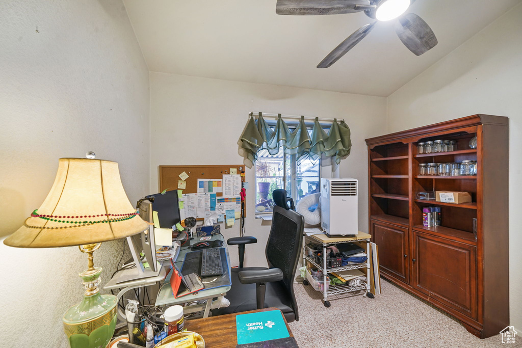 Office featuring carpet, vaulted ceiling, and ceiling fan