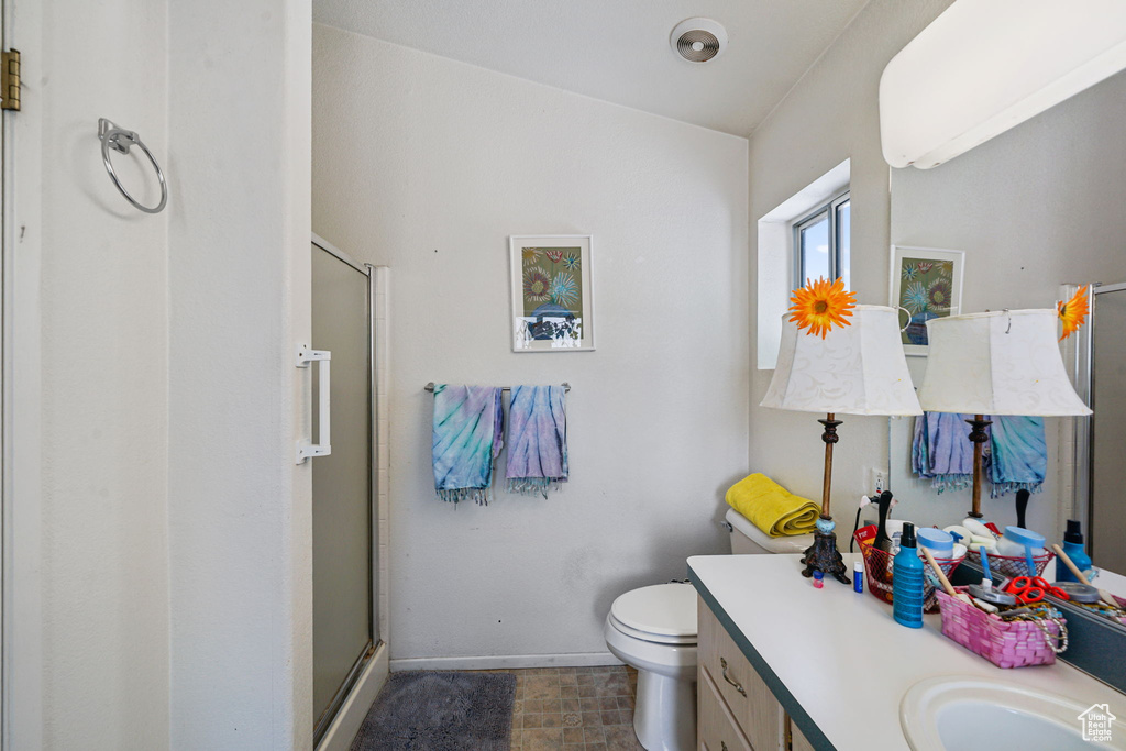 Full bathroom with a stall shower and vanity