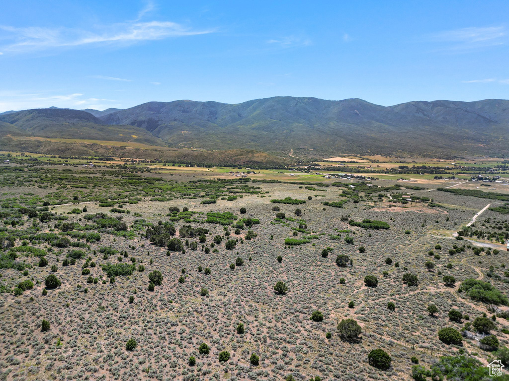 View of mountain backdrop featuring rural landscape
