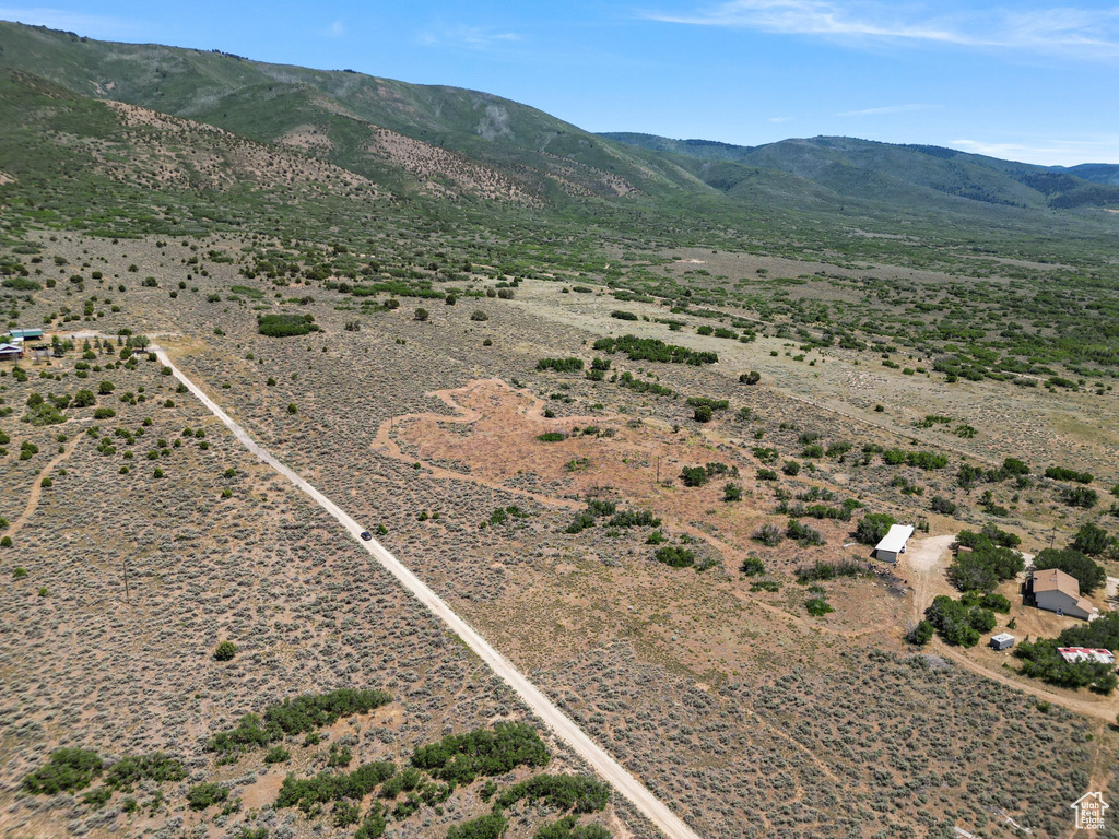 View of rural area featuring mountains and a desert landscape