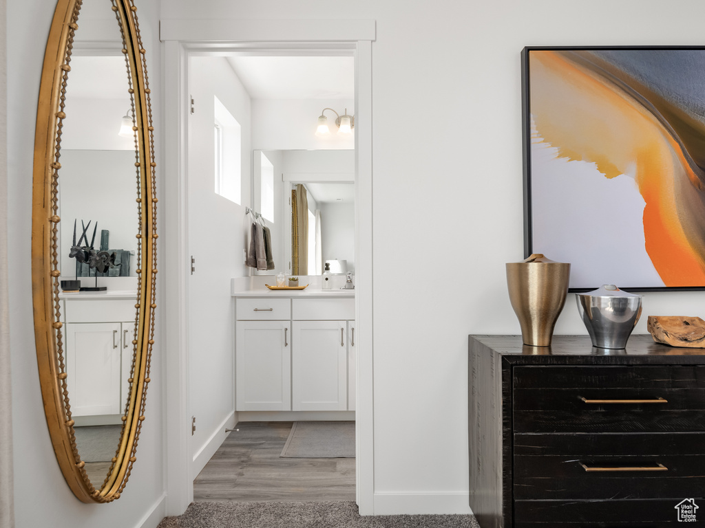 Bathroom with vanity and wood finished floors
