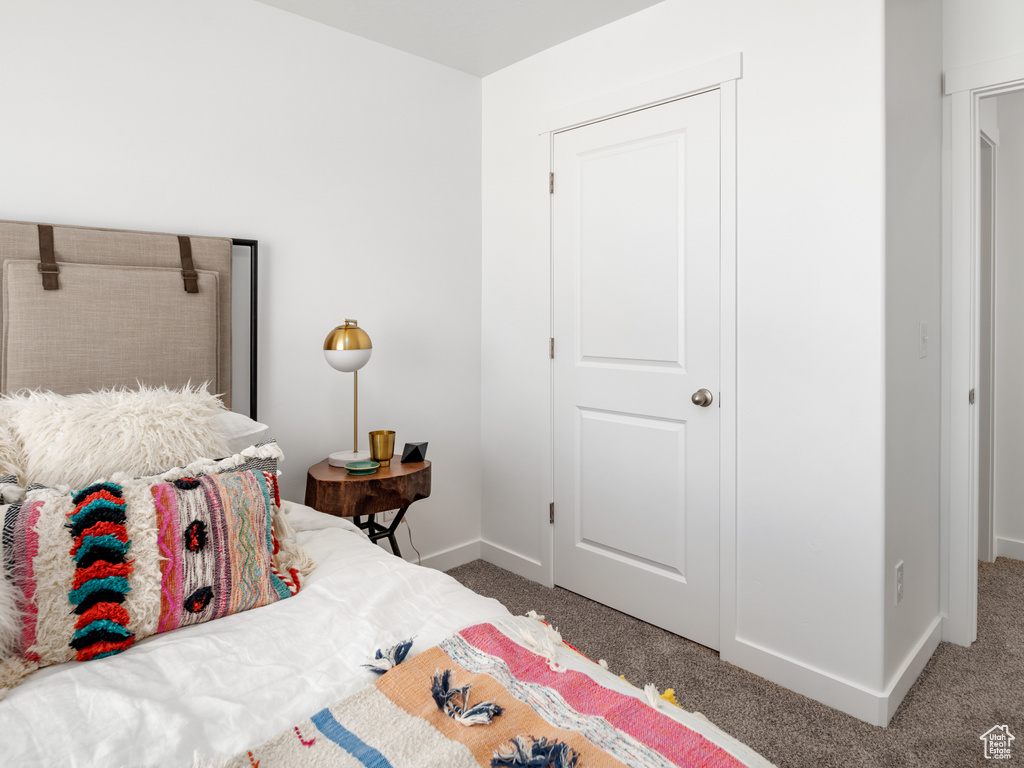 Carpeted bedroom with baseboards