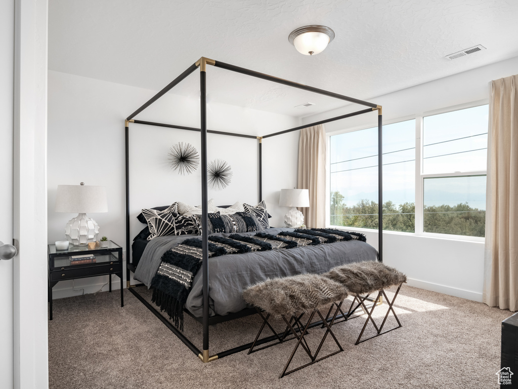 Carpeted bedroom with baseboards