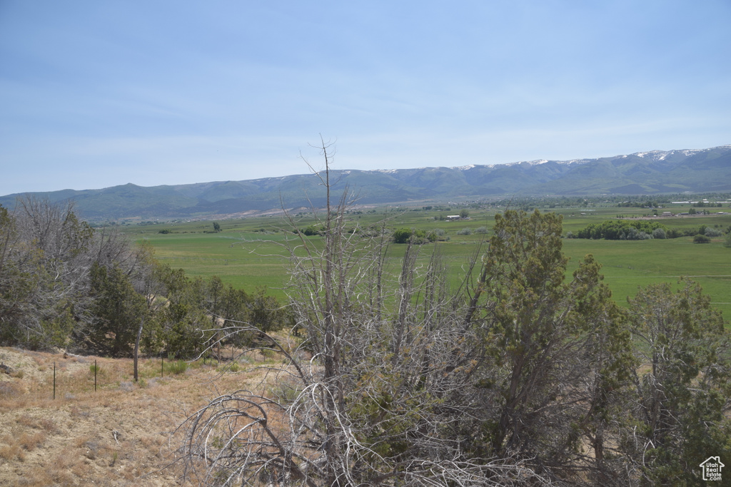 View of mountain backdrop featuring rural landscape
