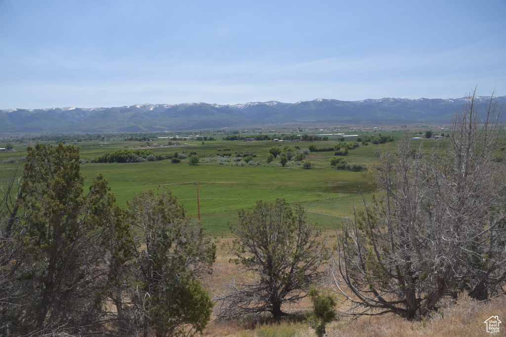 View of mountain background featuring rural landscape