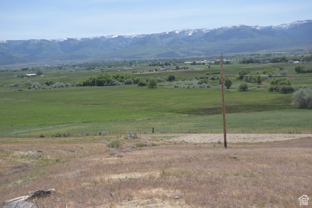 View of mountain backdrop featuring rural landscape