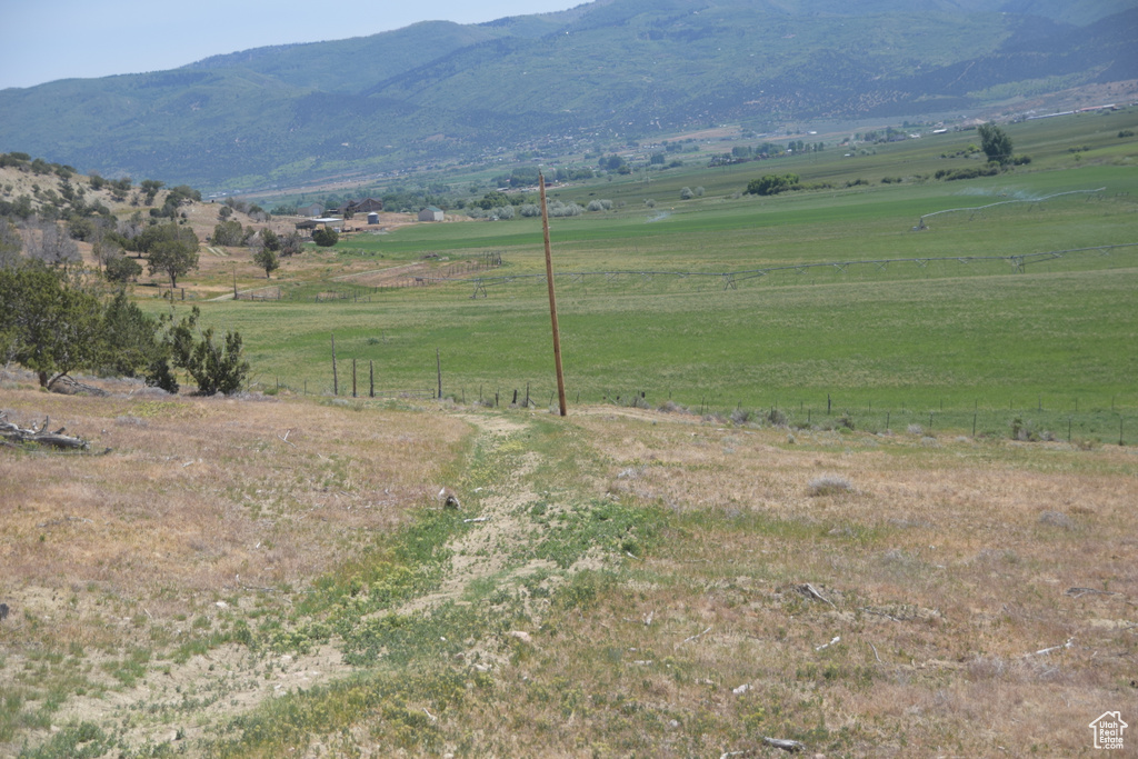 View of mountain backdrop featuring rural landscape and a pastoral area