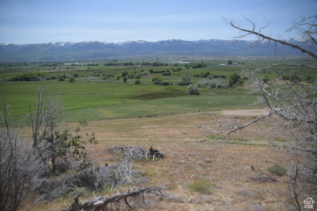 View of mountain background featuring rural landscape
