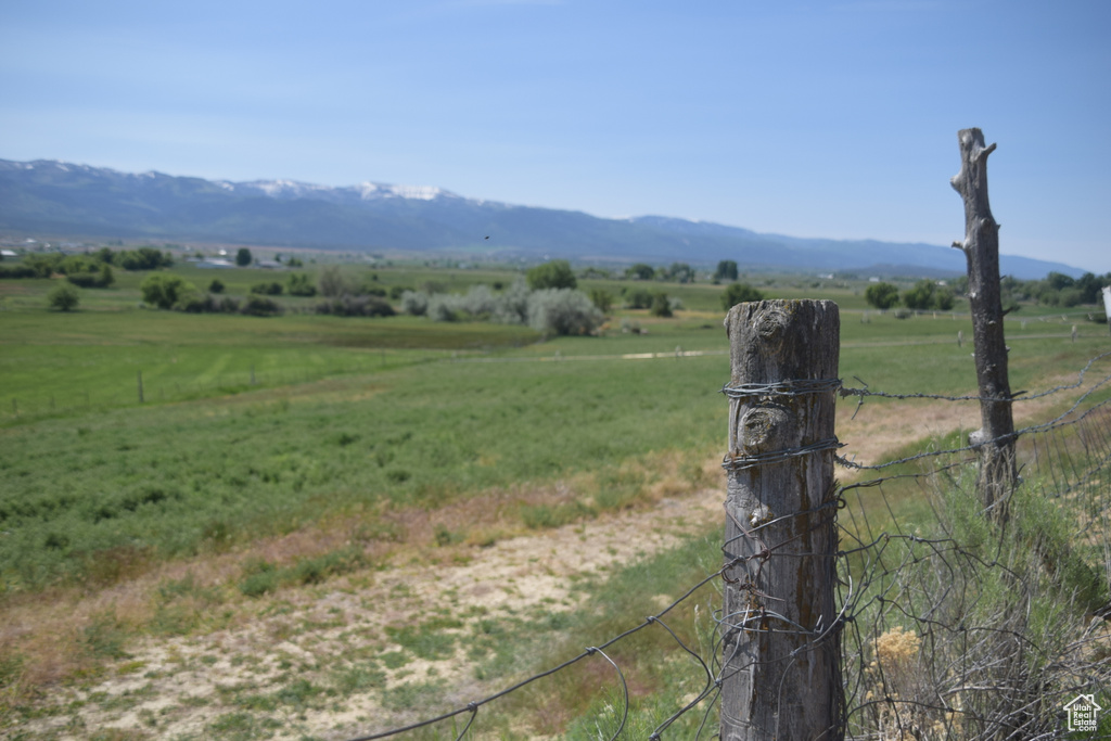 View of mountain backdrop with rural landscape