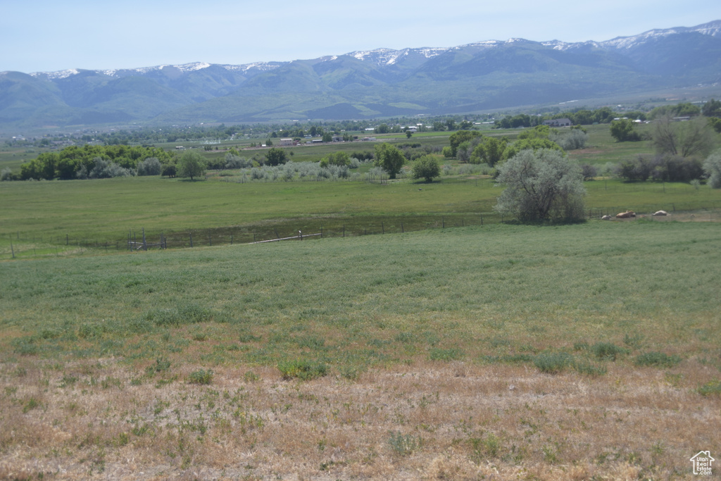 View of mountain backdrop with rural landscape