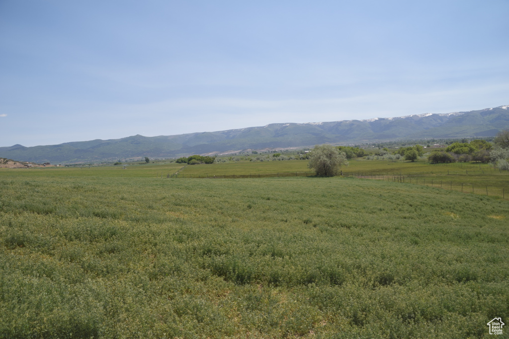 View of mountain backdrop with rural landscape
