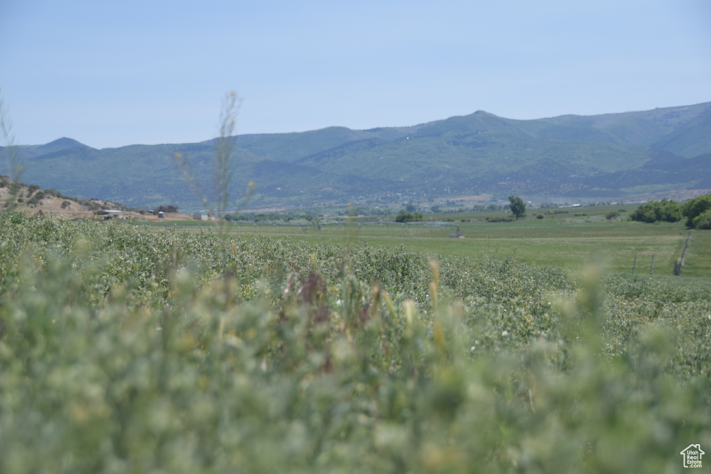 View of mountain backdrop with rural landscape
