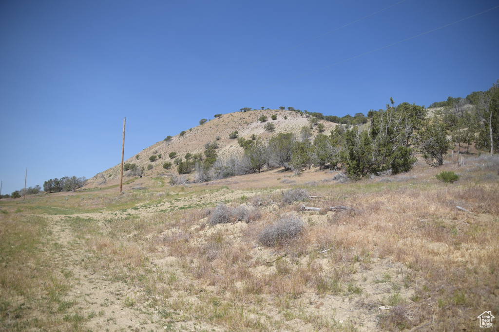 View of mountain backdrop featuring rural landscape