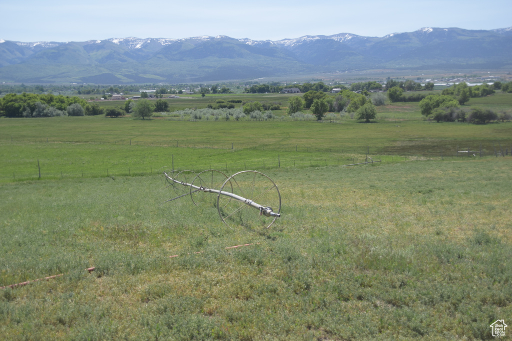 View of mountain backdrop featuring rural landscape