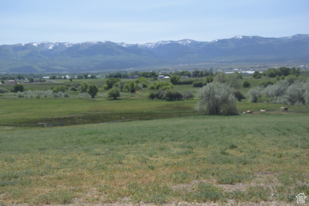 View of mountain backdrop with rural landscape