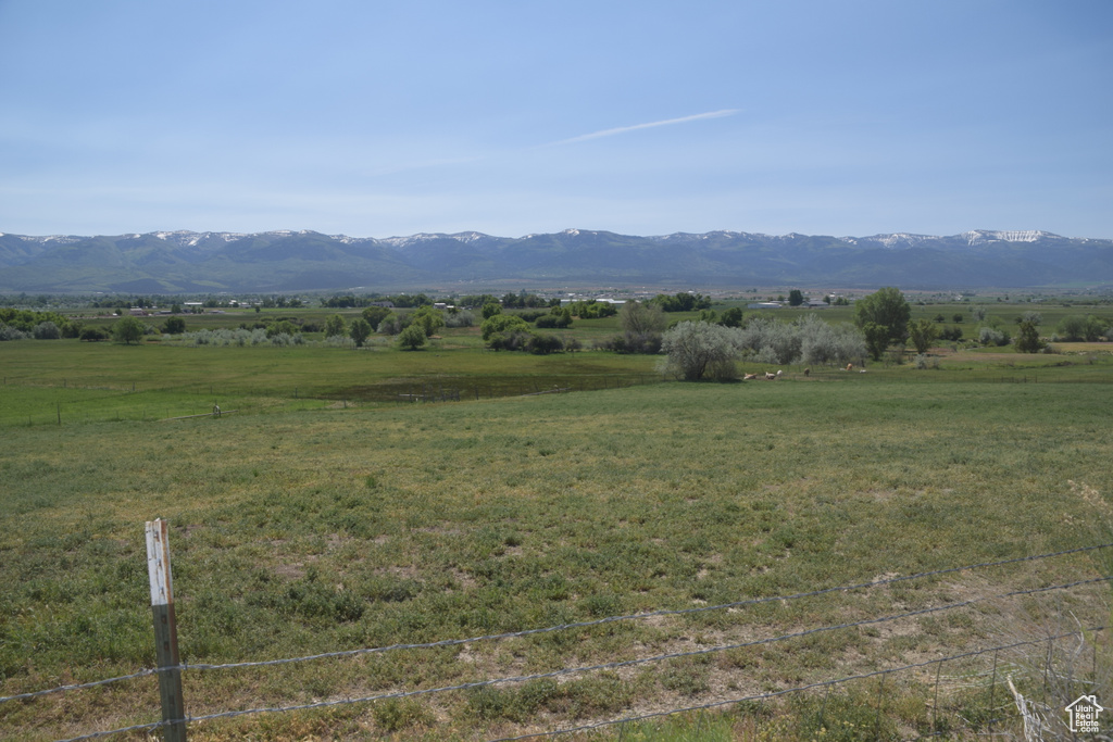 View of mountain backdrop featuring rural landscape