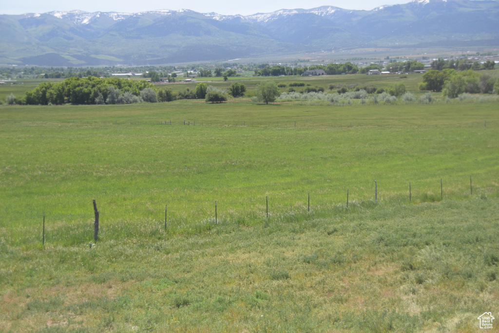 View of mountain backdrop featuring rural landscape