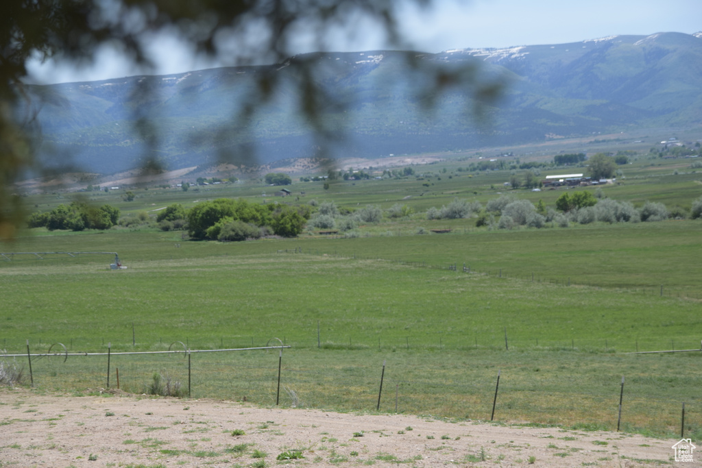 View of mountain backdrop featuring rural landscape and a pastoral area