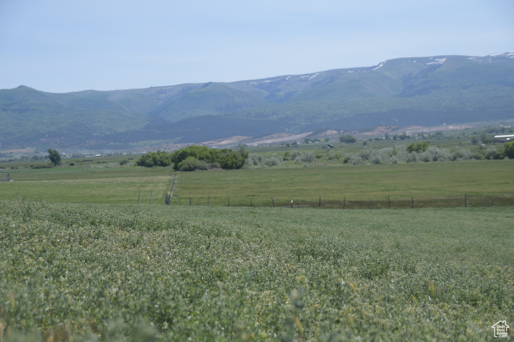 View of mountain backdrop featuring rural landscape