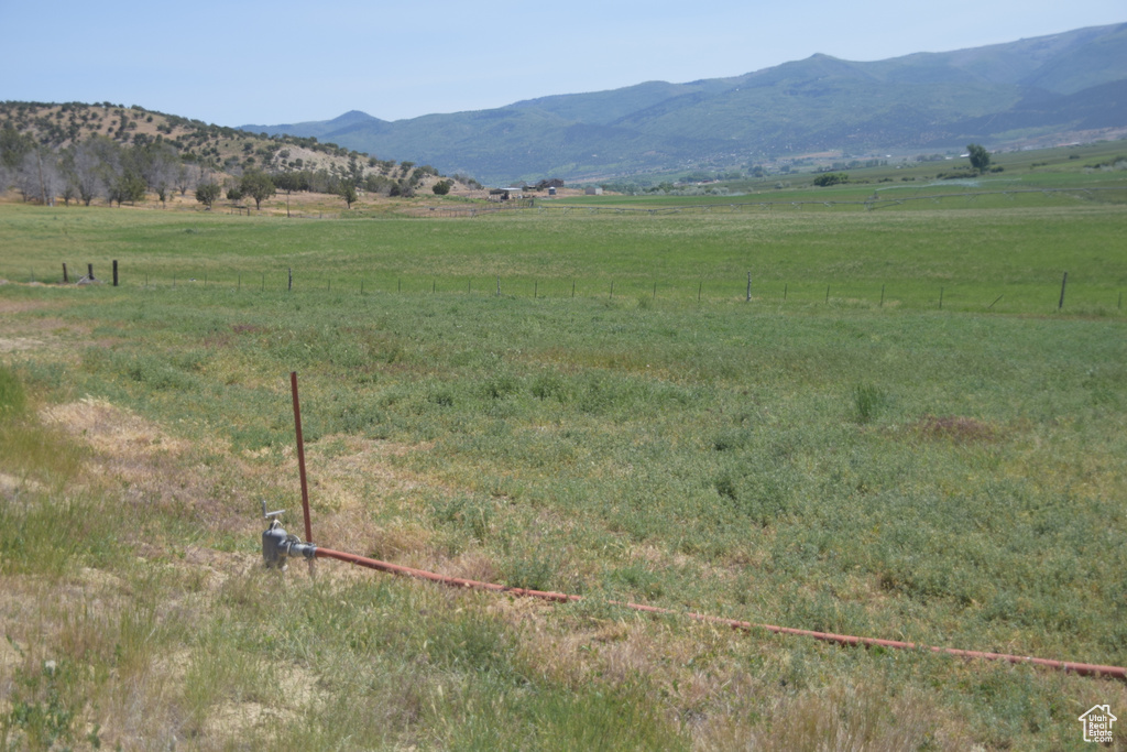 View of mountain background featuring rural landscape