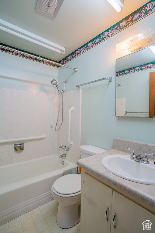 Full bath with vanity, shower / washtub combination, and tile patterned flooring