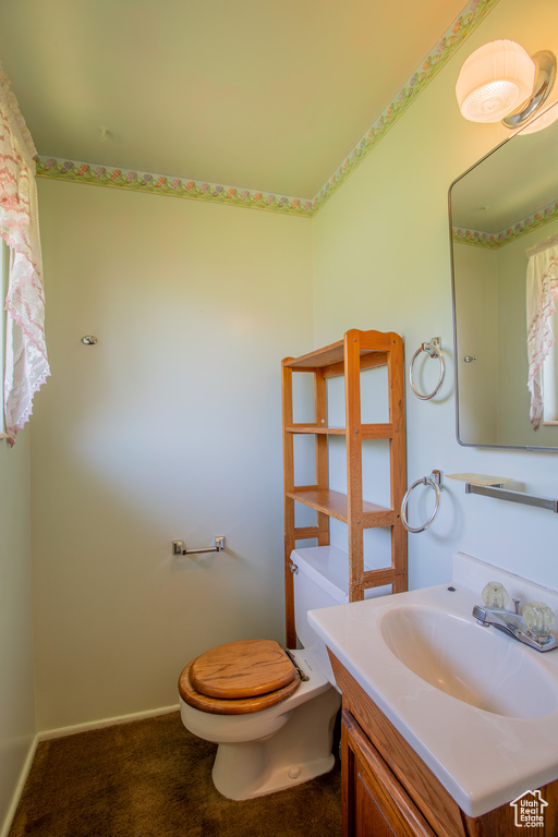 Bathroom featuring toilet and vanity
