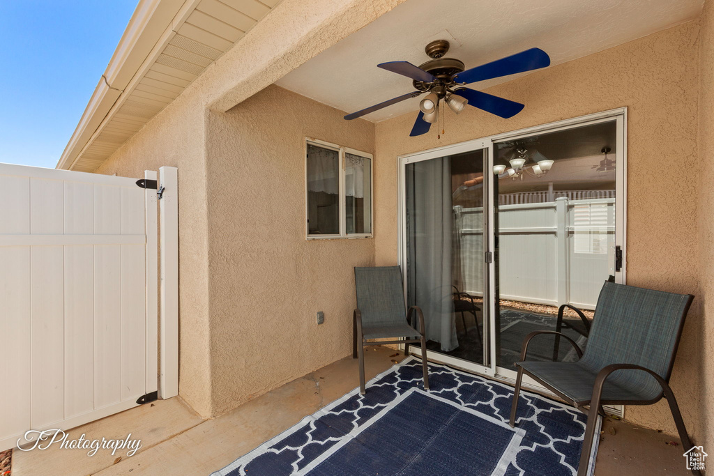 View of patio featuring ceiling fan