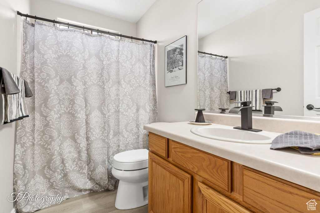 Bathroom featuring vanity and wood finished floors
