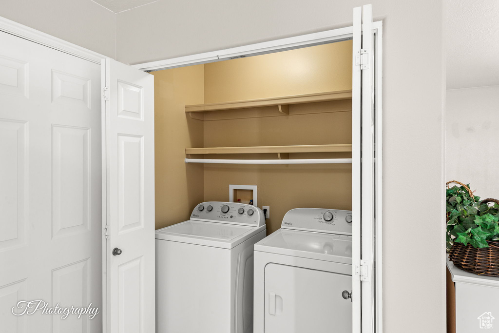 Washroom with washer and clothes dryer