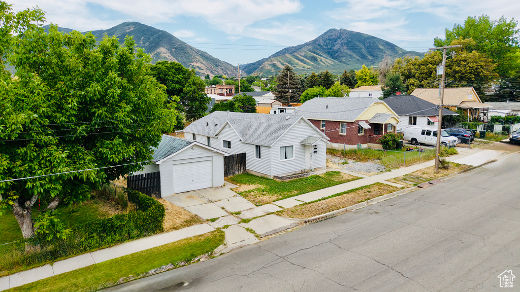 View of mountain backdrop featuring nearby suburban area