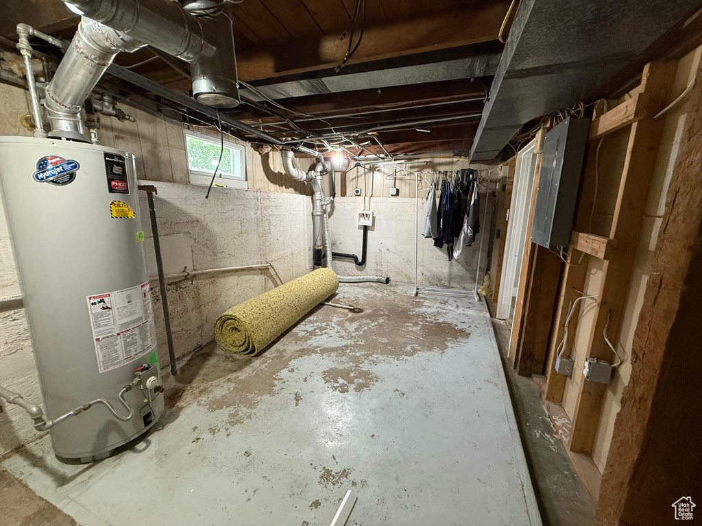 Basement with water heater and electric panel