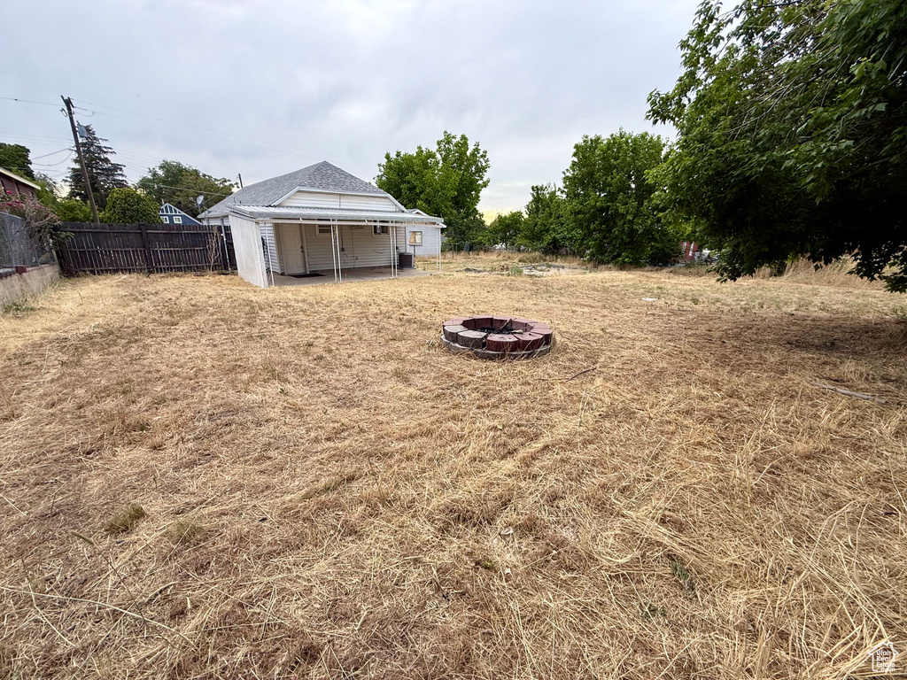 View of yard featuring a fire pit