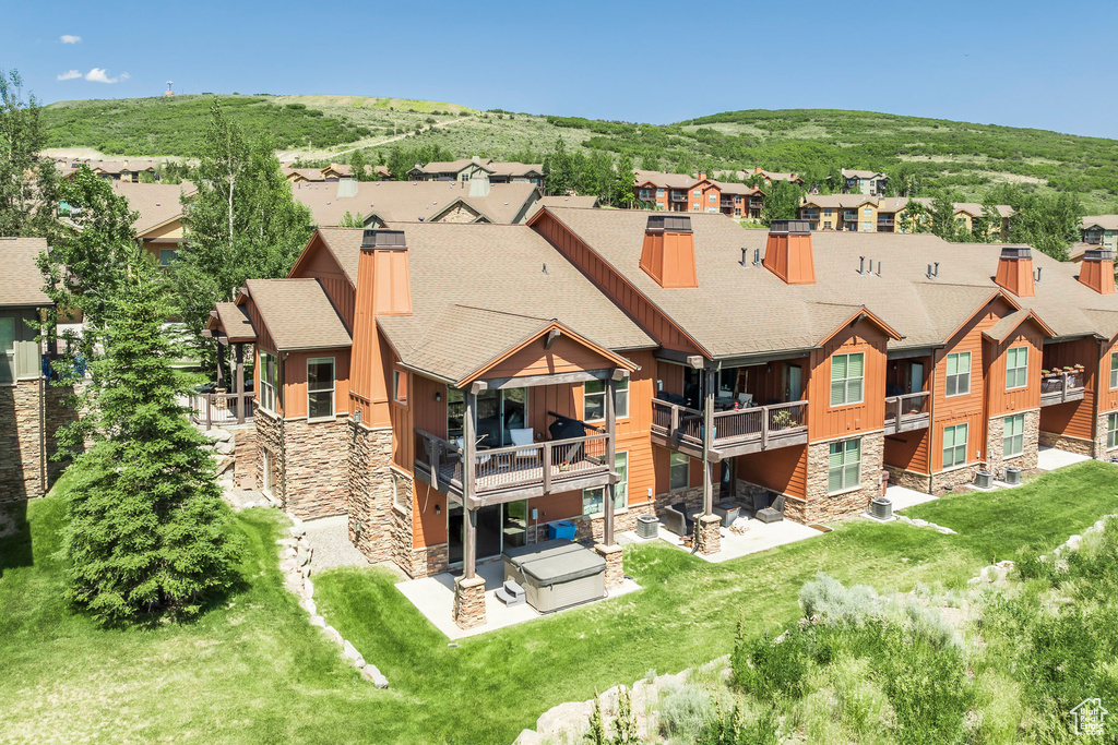 Aerial view of residential area featuring a mountainous background