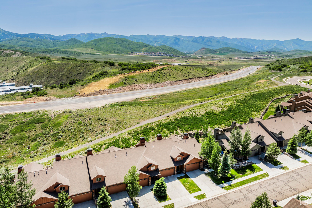Aerial perspective of suburban area featuring a mountainous background