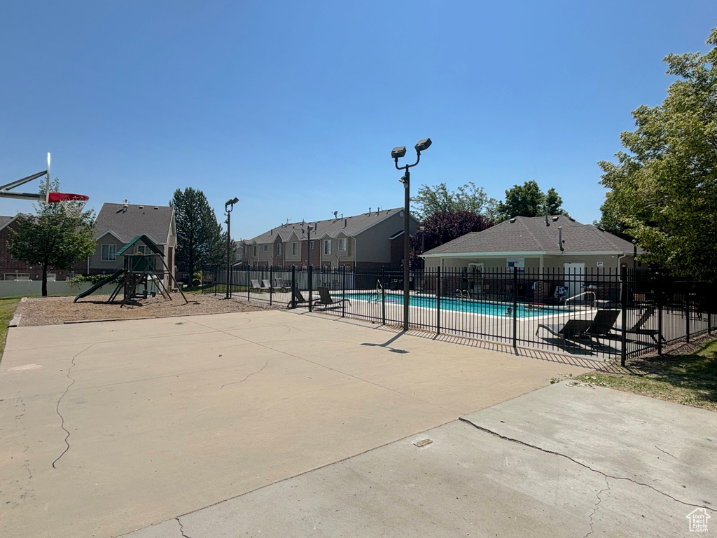 Community pool featuring a residential view and a patio area
