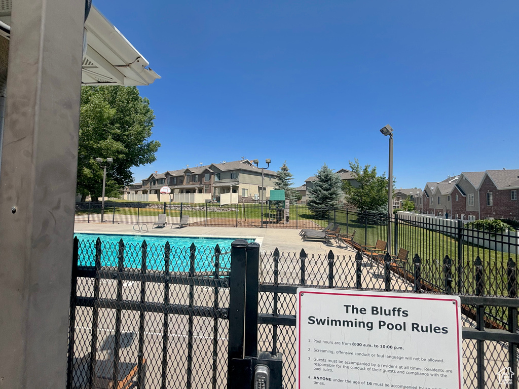 Community pool with a residential view