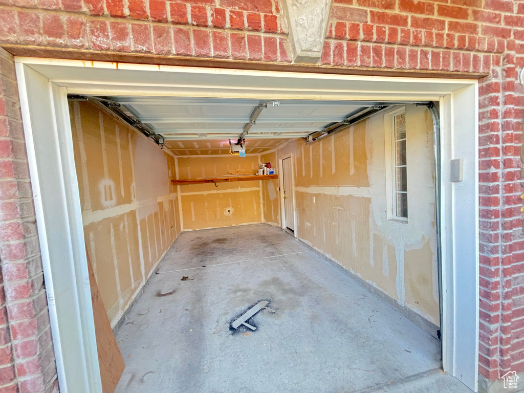 Garage featuring a garage door opener