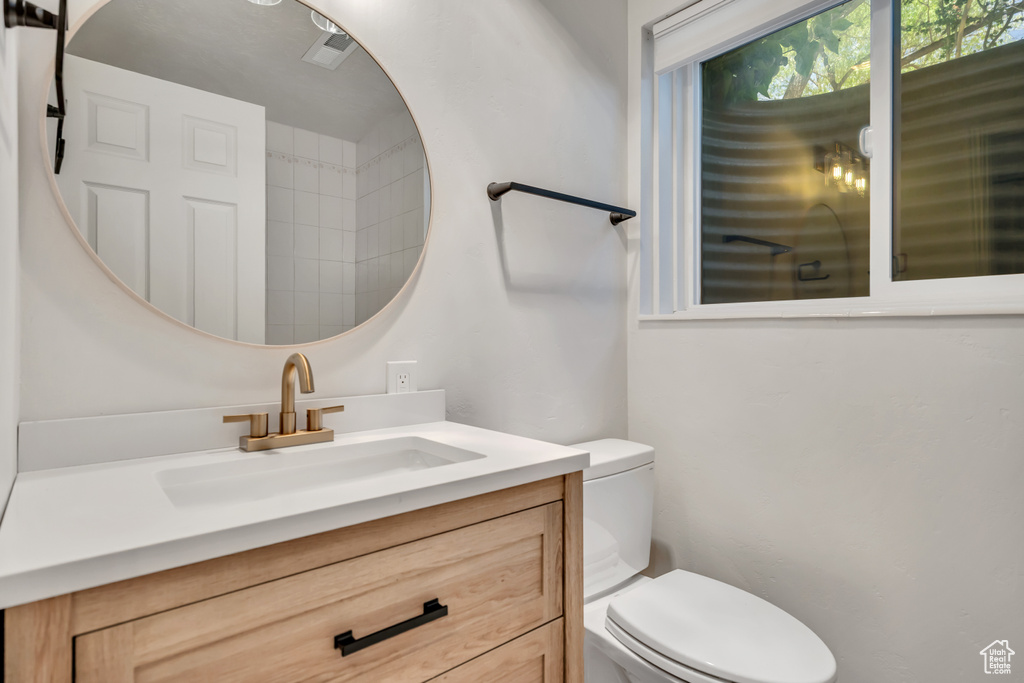 Bathroom with toilet and vanity