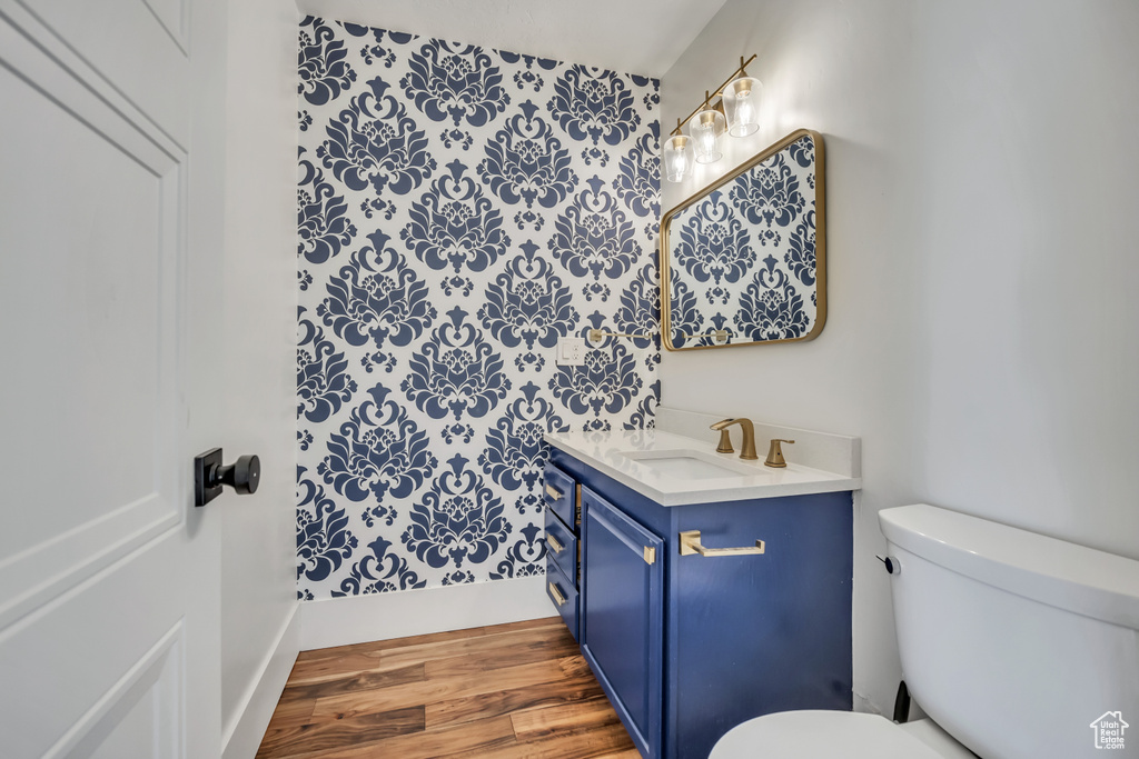 Bathroom featuring vanity and wood finished floors