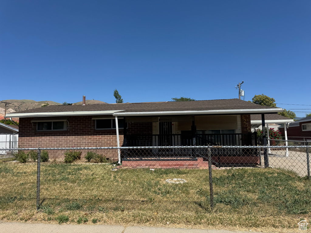 Ranch-style house featuring brick siding