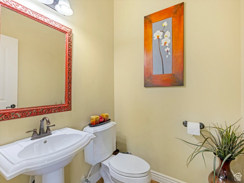 Bathroom featuring a sink and toilet
