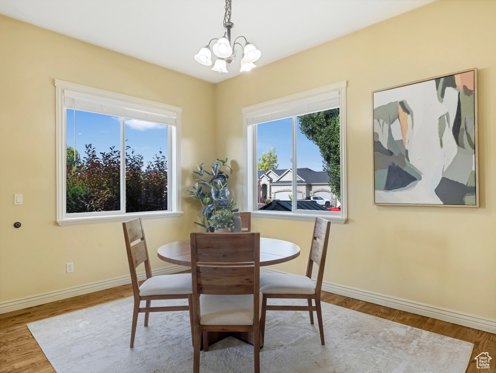 Dining room featuring a chandelier and wood finished floors