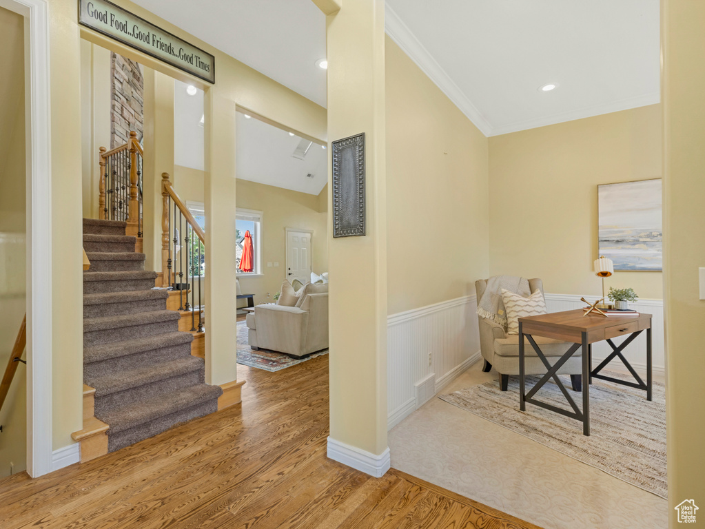 Office space featuring wood finished floors, ornamental molding, a wainscoted wall, and recessed lighting