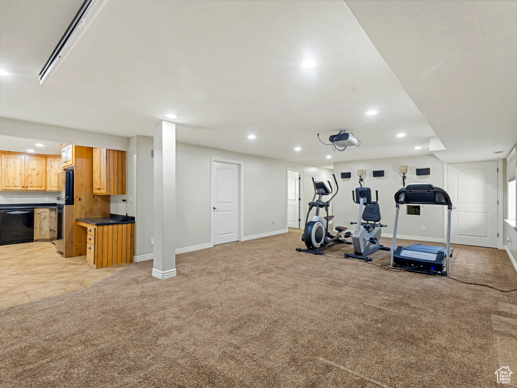 Exercise room featuring light colored carpet and recessed lighting